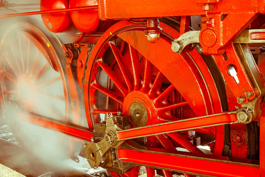 Red wheels of steam locomotive