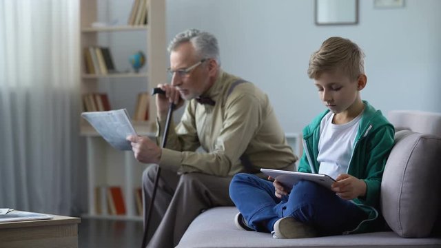 Old man reads press, boy uses tablet, progress symbol from paper to electronics