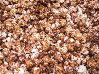 Scattered salted popcorn, texture background.