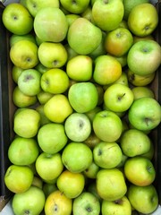 Fresh green apples on the summer market 