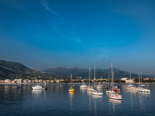 Fototapeta na wymiar Boats in Baia delle Favole in front of Sestri Levante
