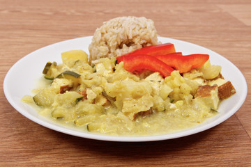 Cauliflower mixture with curry and rice on a table