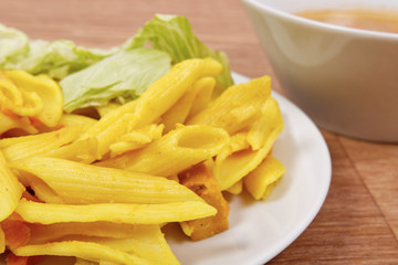 Baked pasta with curry on a table