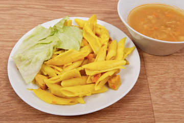 Baked pasta with curry on a table