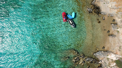 Aerial photo of jet ski docked in tropical turquoise clear water seascape