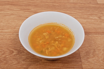Groat soup with vegetables on a table