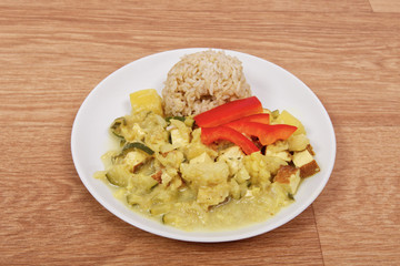 Cauliflower mixture with curry and rice on a table