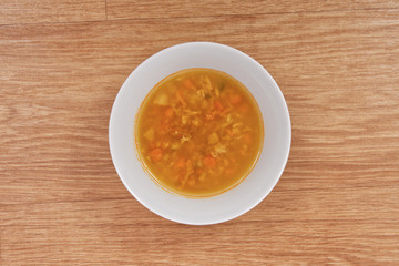 Groat soup with vegetables on a table