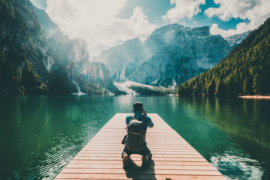 Traveler taking photo of Lake Braies in Italy.