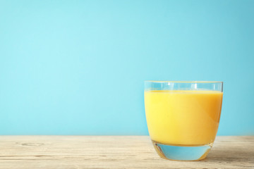 Glass with delicious detox smoothie on table