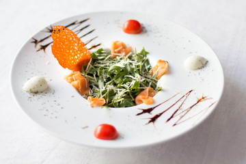 Speciality from chef on white plate at table. Cuisine design concept.