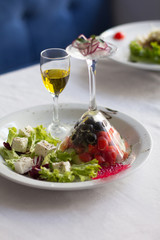 Designed chef salad on white plate. Close up image of business lunch food/