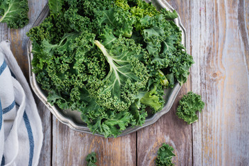 Green kale leaves on plate