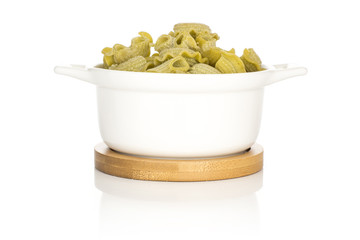 Pasta creste di gallo spinach in a ceramic pot set isolated on white background raw.