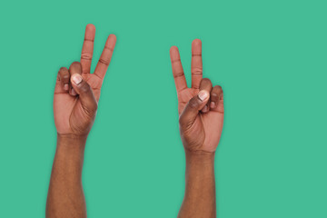 Black hands shows number two isolated