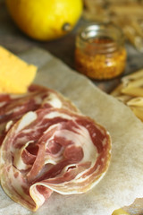 Pancetta (dried pork bacon) Italian cuisine. food background