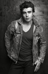 Fashion portrait of beautiful men. Stylish denim jacket, hairstyle, happy smile