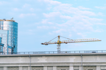 Construction crane against the building