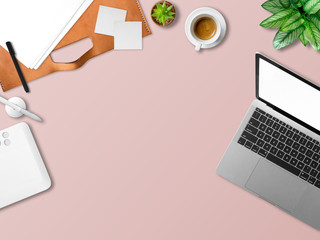 Flat lay of modern laptop workspace office of freelance with coffee cup waffles and document papers.