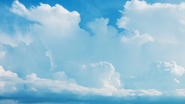 Time lapse white fluffy cumulus clouds flying, fast moving blue sky at cloudy summer day