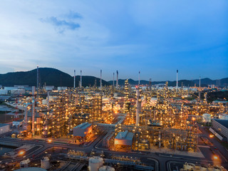 Aerial view of steel pipe oil refinery plant, power plant at sunset sky for industry concept.