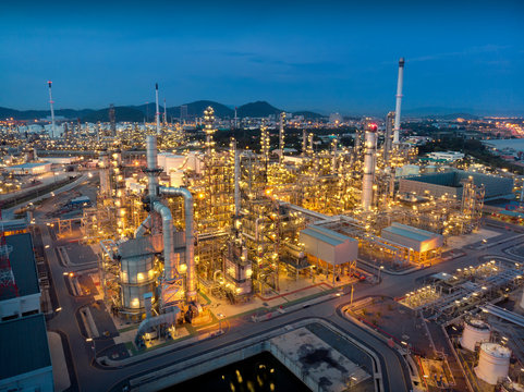 Aerial View Of Chemical Oil Refinery Plant, Power Plant At Sunset Sky For Industry Concept.