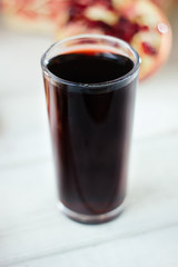 Fresh organic juice made from pomegranate seeds.