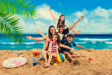Happy Indian/Asian family playing at the beach. Summer vacation concept
