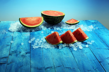 watermelon on blue background. juicy summer fruit in slices