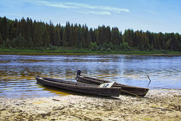 Unusual elongated wooden boats of the Mansi people in Siberia
