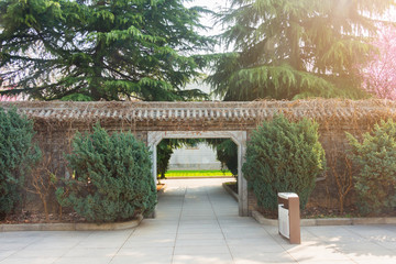 Path through an Arched Gateway to garden.