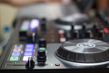 Fototapeta na wymiar remote and mixer DJ for music