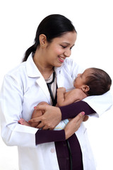 Newborn baby examination by doctor woman - 205913991