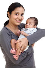 Cheerful mother holding newborn baby