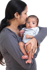 Cheerful mother holding newborn baby