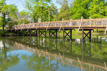 Fototapeta premium Wooden Bridge over Spring Lake
