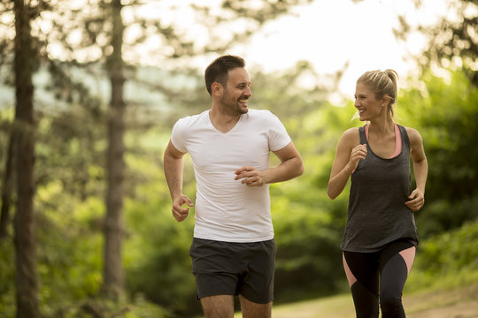Couple jogging outdoors in nature