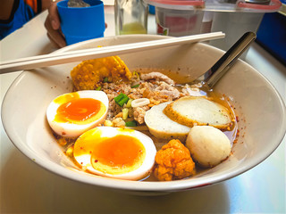 A Bowl of Spicy Noodle with Boiled Egg