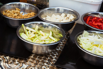 Sliced zucchini, cabbage, red sweet pepper, and tofu cheese