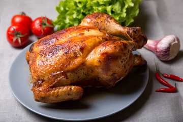 Chicken baked whole. Selective focus, close-up.