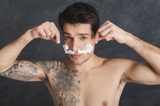 Young Sexy Tattooed Man With Moustaches From Foam