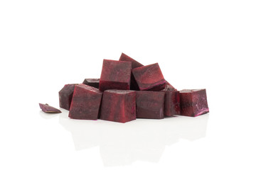 Red beet slices cut squared pieces isolated on white background.