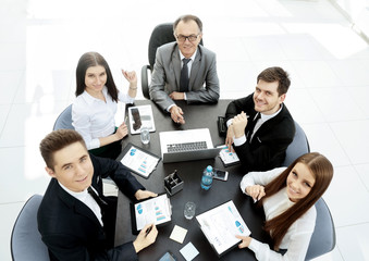 successful businessman and his business team meeting in modern office