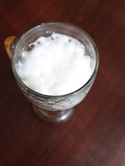 a glass of beer on the table