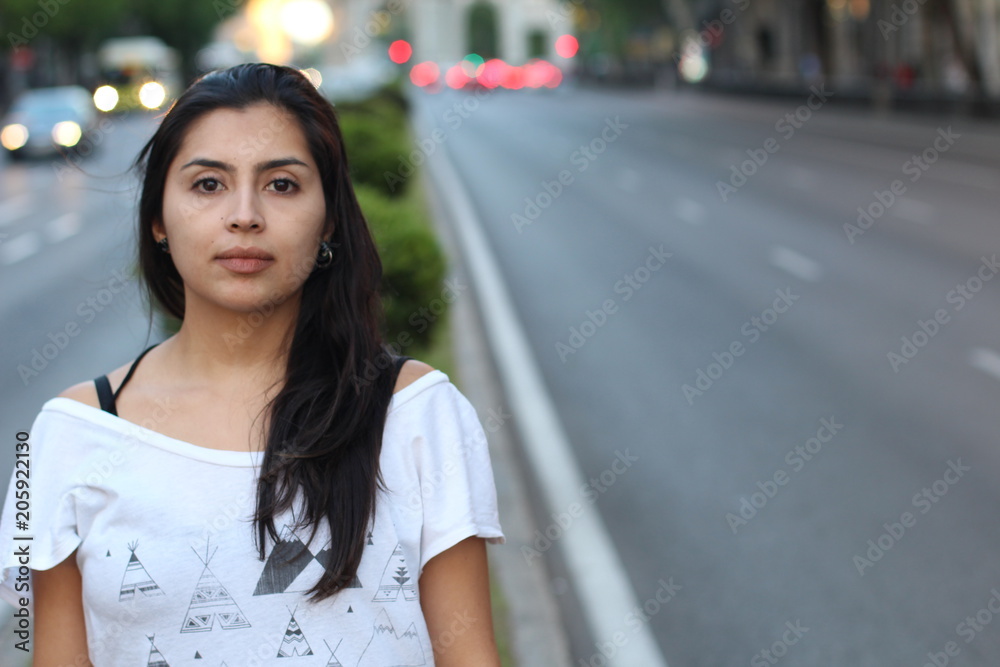 Wall mural ethnic woman daydreaming on the street