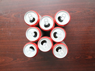 a few beer cans on a dark background
