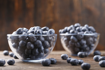 ripe organic bog whortleberry in a wooden plate