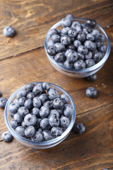 ripe organic bog whortleberry in a wooden plate