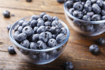 ripe organic bog whortleberry in a wooden plate