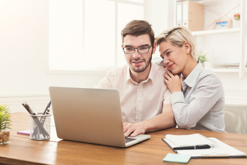 Couple of business partners work at modern office